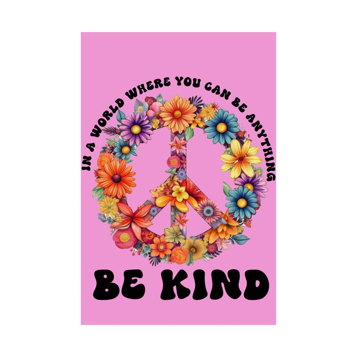 Peace symbol made of flowers with 'Be Kind' text on a pink background