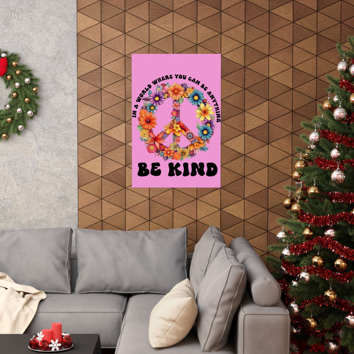 Living room with a pink poster featuring a peace symbol and flowers, a gray sofa, and a decorated Christmas tree.