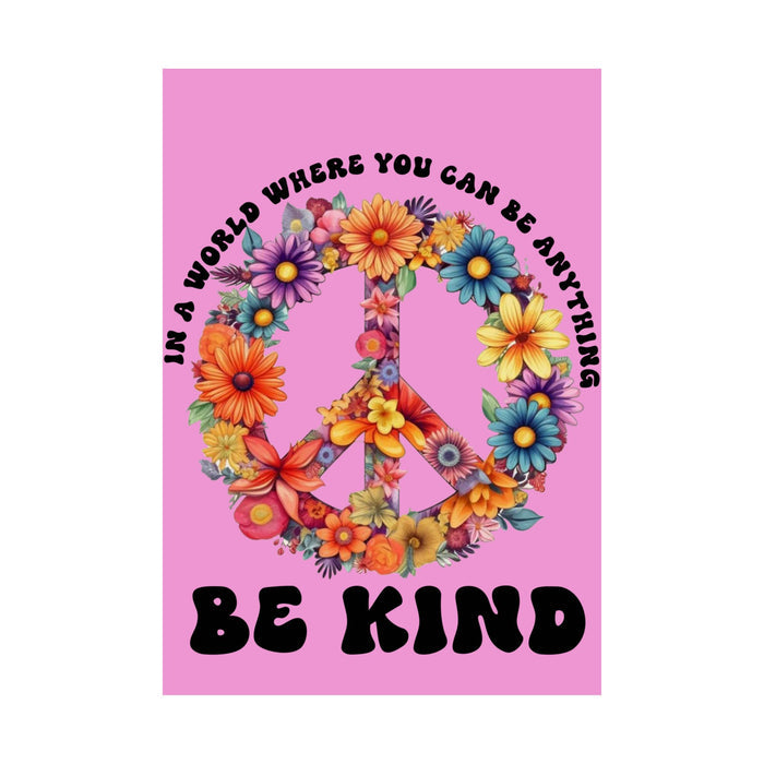 Colorful peace symbol made of flowers with text 'In a world where you can be anything, be kind' on a pink background