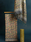 Charcoal grey and olive green Katan silk unstitched suit set with all-over floral paisley block print in muted earth tones, peach and pale yellow accents and a tasselled dupatta