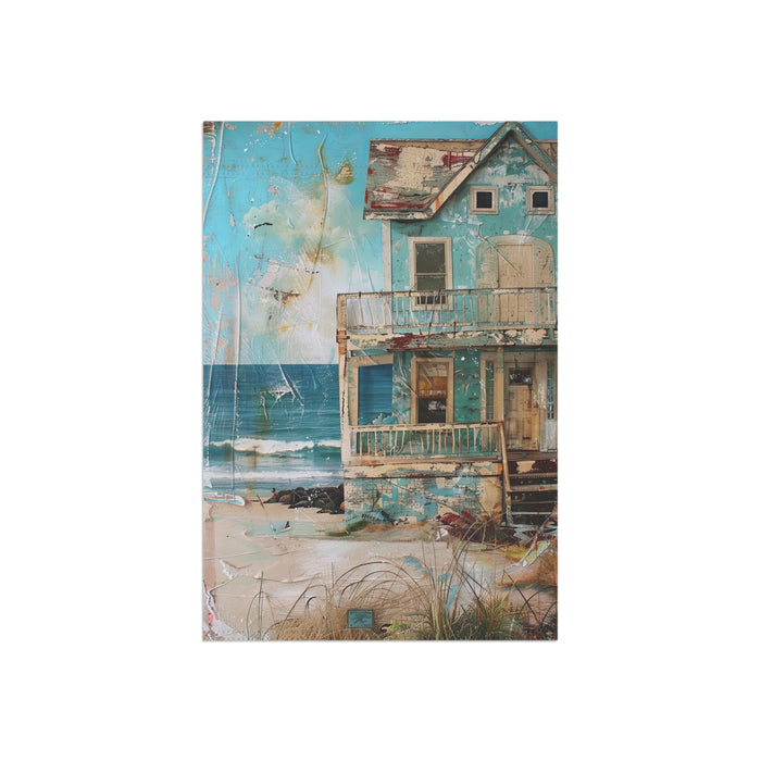 Decorative notebook with a beach-themed cover featuring a house and ocean.