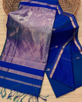 Cobalt blue Maheshwari silk saree with small dobby-set buti and a lavender pallu banded in copper, handwoven in Maheshwar