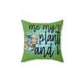Green pillow with floral design and text 'me my plants and i' on a white background