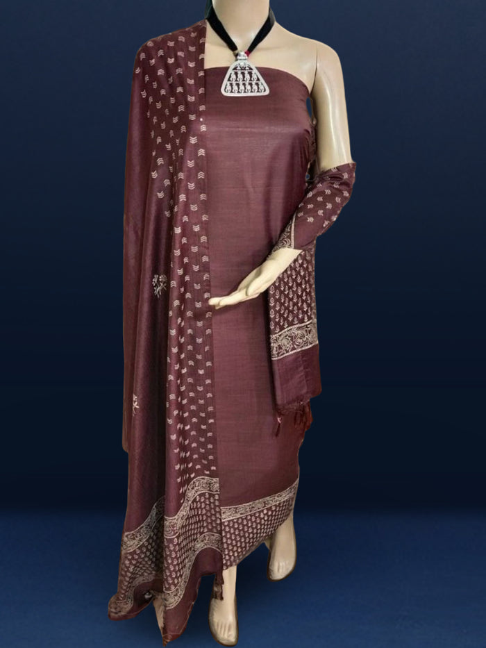 Dark brown Katan silk unstitched suit set with all-over off-white paisley on the top, a plain brown bottom piece and a dupatta with a wide patterned end panel