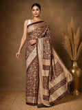 Dark brown Kashmiri Silk printed saree with an all-over paisley and floral print in cream, burnt orange and muted gold, a block-panelled pallu and a dark-brown border with a lighter inner trim.