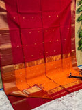 Dark red Maheshwari silk saree with a bicolour orange flower buti pallu, golden double design zari border and contrast blouse piece.