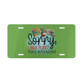 Green license plate with plant-themed design and text on a white background