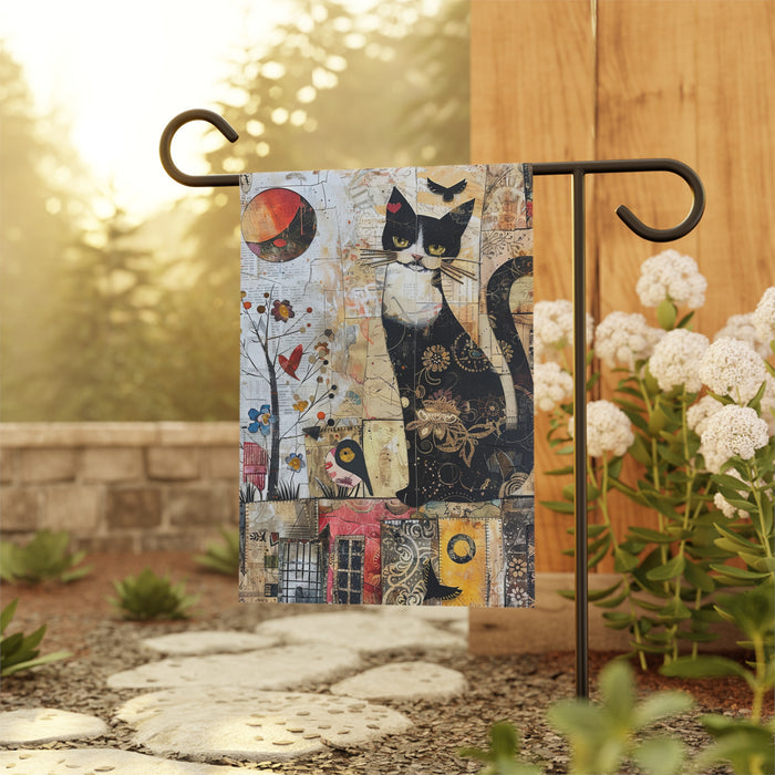 Decorative garden flag with a black cat design on a stand outdoors.