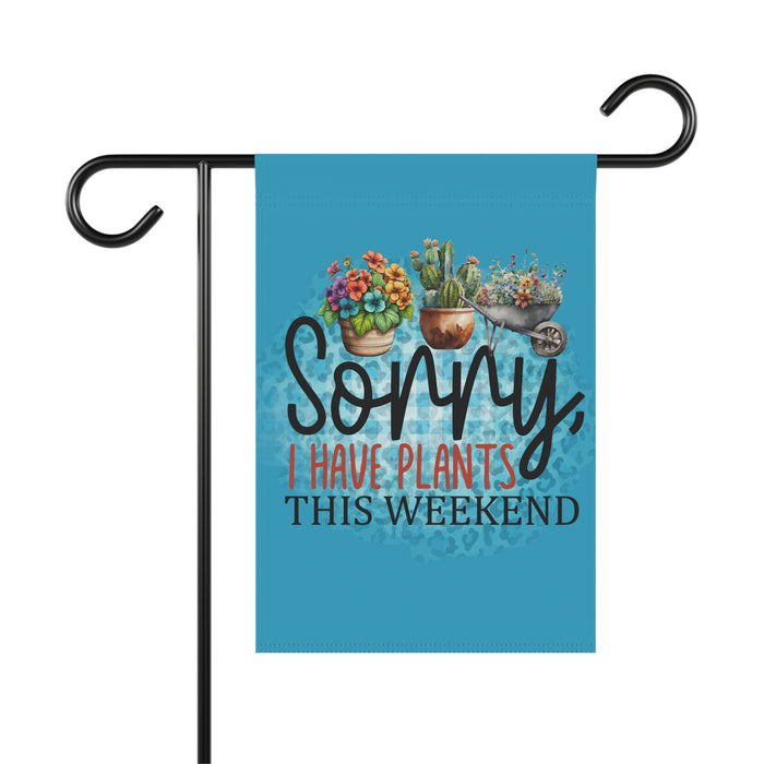 Garden flag with plants and text 'Sorry, I have plants this weekend' on a blue background