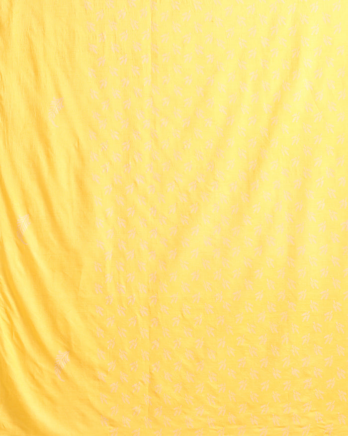 Golden yellow katan silk unstitched suit set with a small white leaf hand block print and a circular floral band with fringe on the dupatta