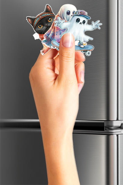 Hand holding two decorative magnets in front of a refrigerator.