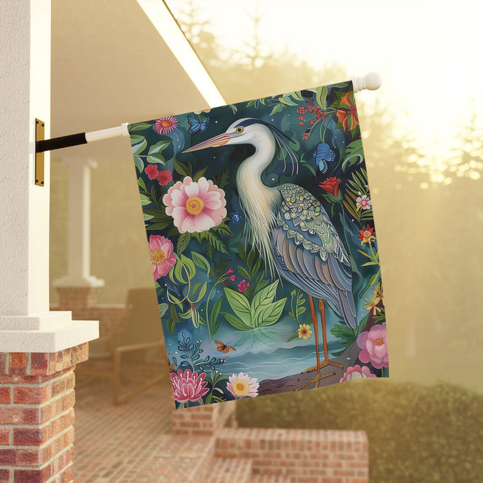 Decorative flag with a heron and floral design hanging on a porch.