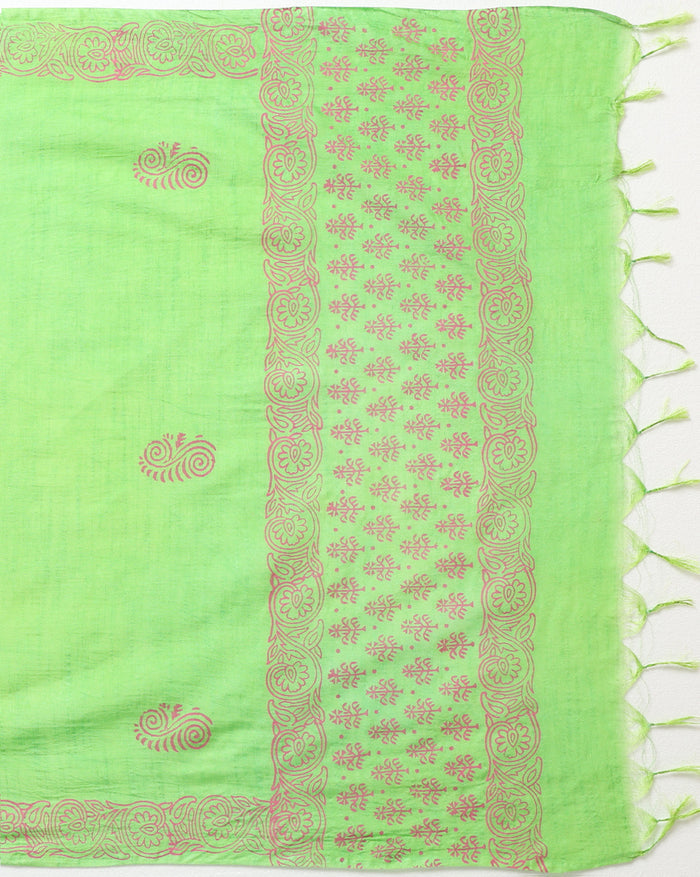 Lime green katan silk unstitched suit set hand block printed with terracotta botanical motifs, shown with a bordered dupatta finished in a short fringe.