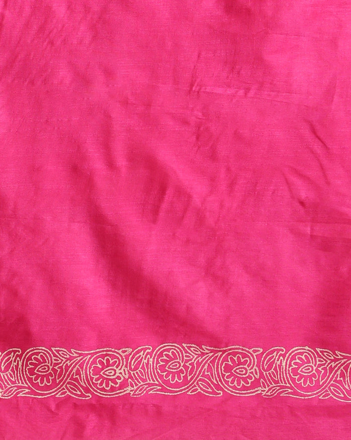 Magenta katan silk unstitched suit set hand block printed with small off-white sprigs, shown with a tasselled dupatta bordered in floral garlands and a plain bottom.