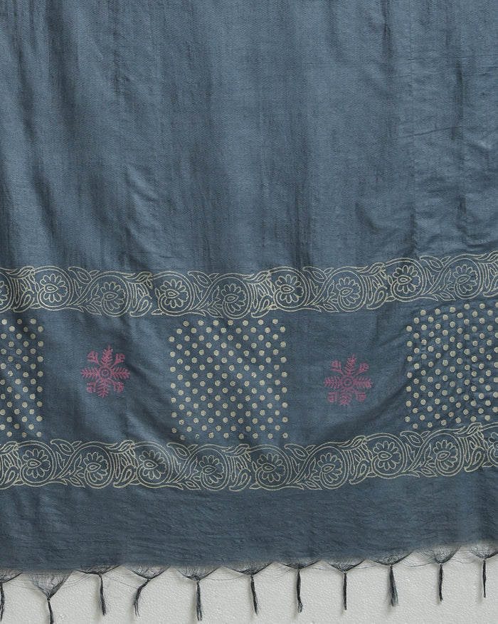 Deep metallic blue Katan silk suit set hand block printed with asymmetric sections of off-white polka dots and muted pink abstract florals, with a scrolling vine border on the dupatta.