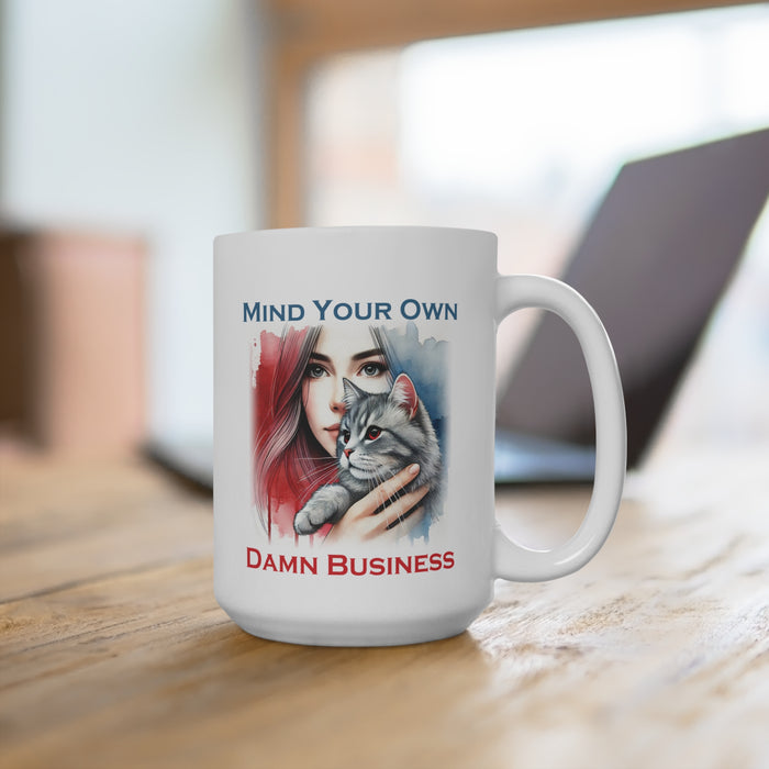 Mind Your Own Damn Business Coffee Mug on a table