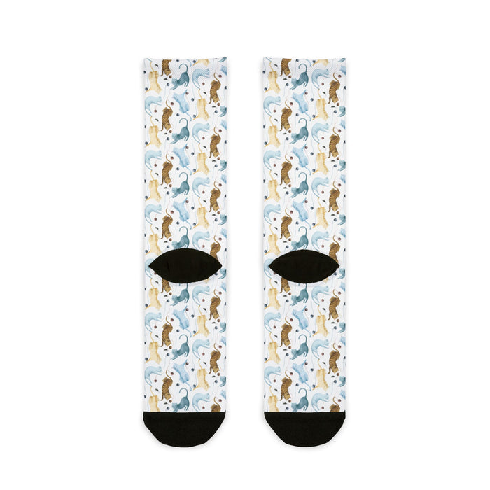 Pair of socks with a pattern of dogs on a white background