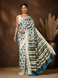 Off White Kashmiri Silk printed saree with an all-over teal and olive botanical leaf print and a wide end-panel of teal, olive-green and dark-brown stripes over an off-white base, with a narrow textured border.