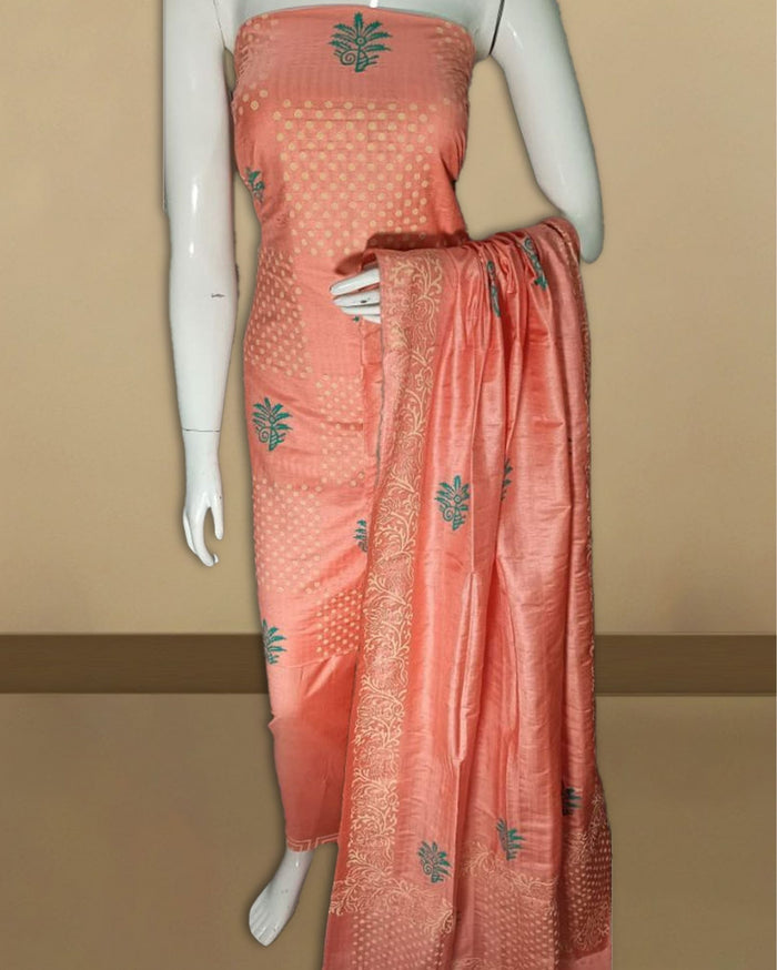 Peach Katan silk suit set hand block printed in a checkered grid of light blue and white polka dot panels alternating with fern leaf motifs, edged with a decorative band.
