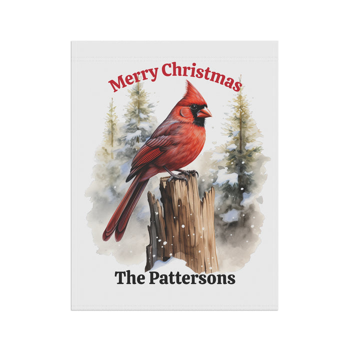 Christmas card with a red cardinal on a log and snowy trees, personalized for 'The Pattersons'.