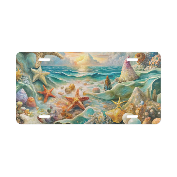 Decorative license plate with a beach scene featuring starfish, shells, and a sunset.