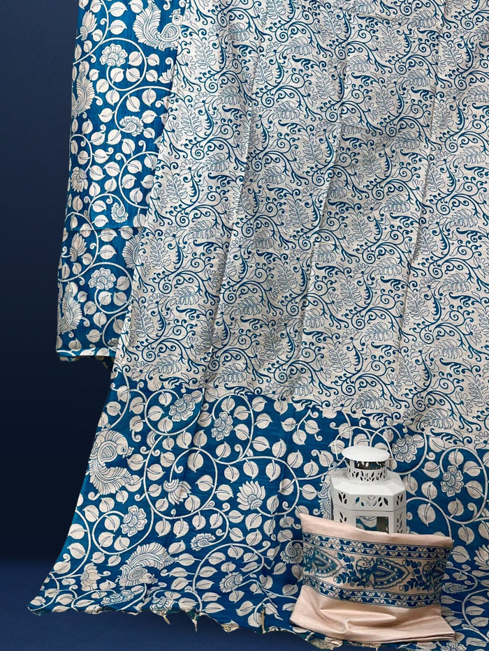 Royal blue Katan silk unstitched suit set with medium-scale cream floral and paisley block print, light pink detail inside the blooms and a tasselled dupatta edge