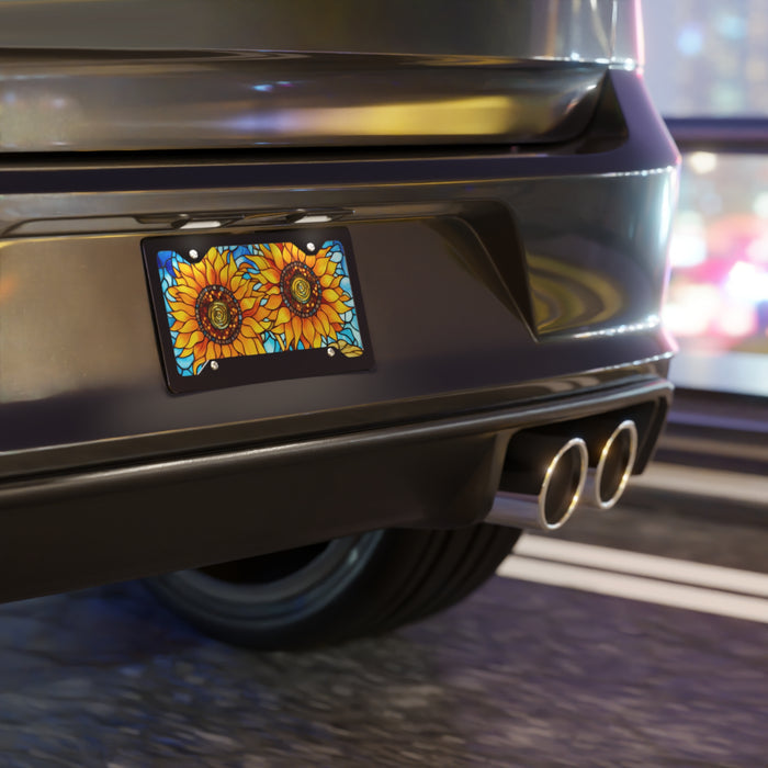 Car rear with sunflower license plate in an urban setting