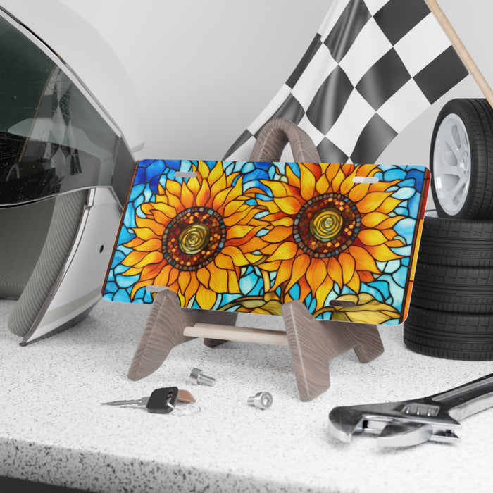 Colorful sunflower design on a laptop stand with tools and tires in the background