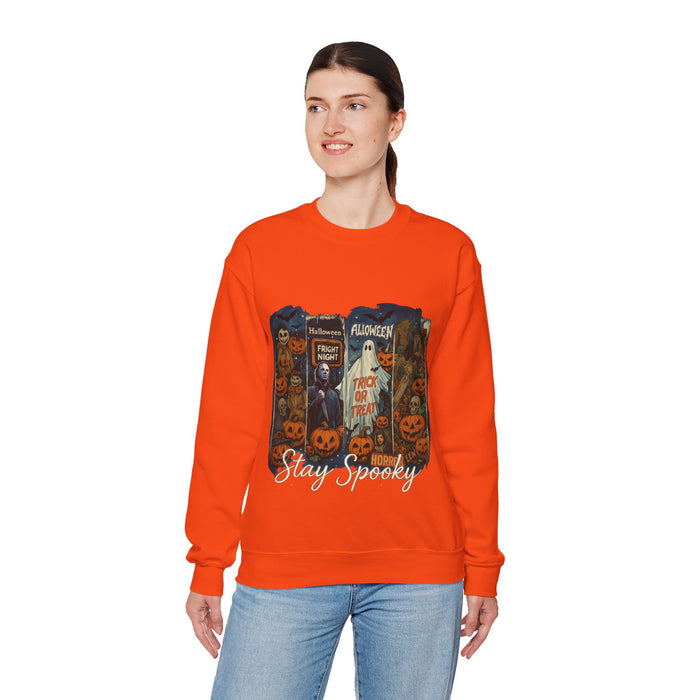 Person wearing an orange sweatshirt with Halloween-themed design on a white background