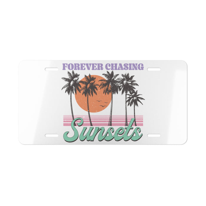 License plate with palm trees and sunset design, text 'Forever Chasing Sunsets' on a white background