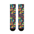 Colorful book-patterned socks on a white background