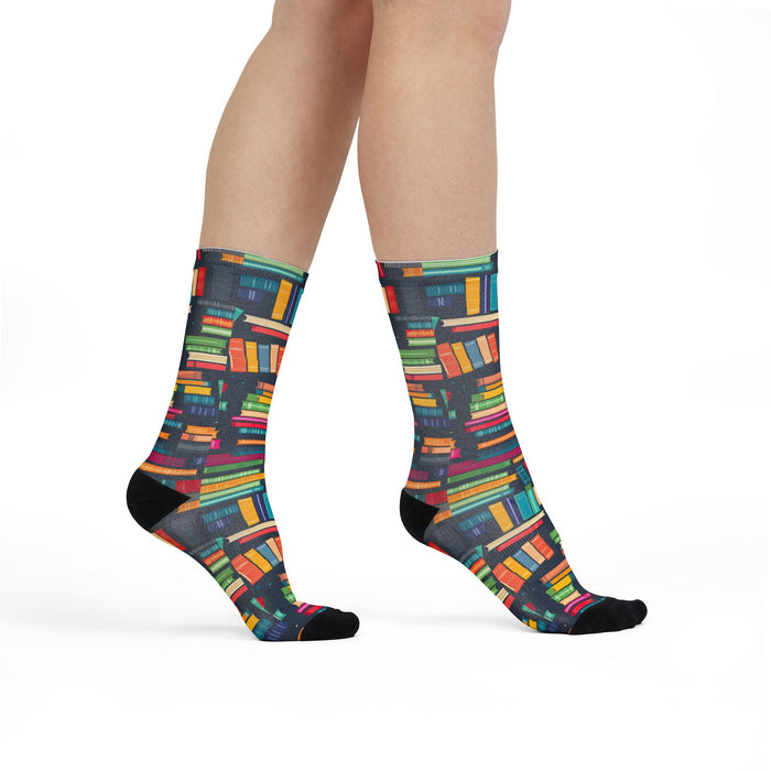 Colorful book-patterned socks on a white background