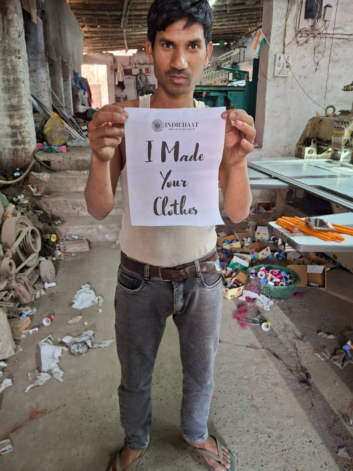 Pink katan silk unstitched suit set with a small floral block print in teal and violet, shown with a dupatta bordered by a wide band of the same flowers.