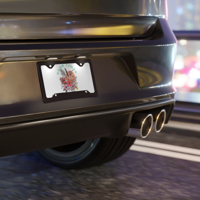 Close-up of a car's rear end with a decorative license plate on a blurred street background