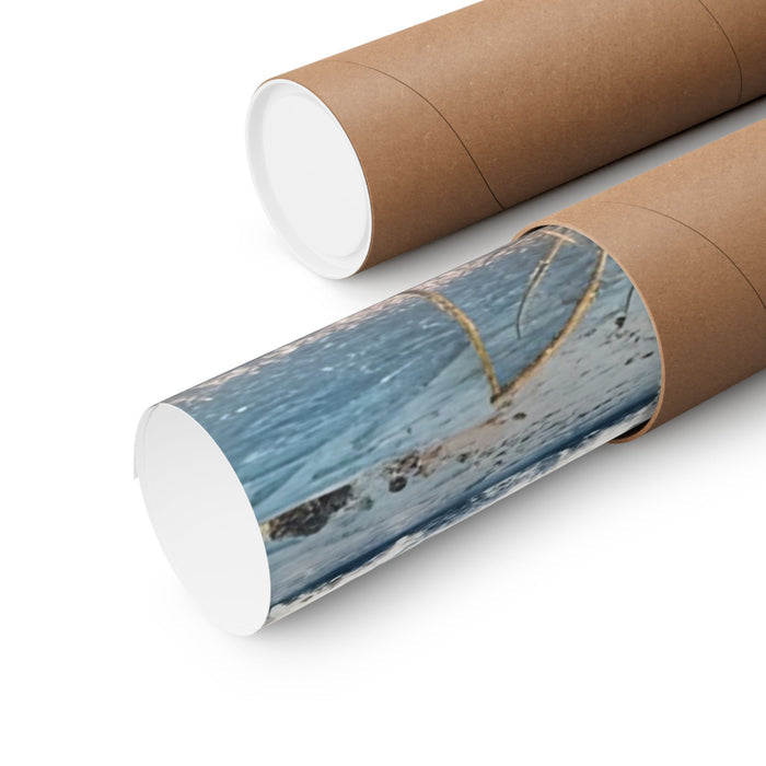 Roll of wallpaper with a beach design on a cardboard tube against a white background
