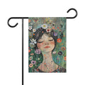 Garden flag with an illustration of a girl surrounded by flowers and butterflies on a white background.