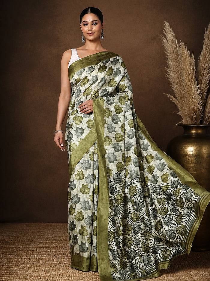 White Kashmiri Silk printed saree with a scattered olive-green and grey leaf print, a dense abstract botanical end-panel, and a wide solid olive-green border.